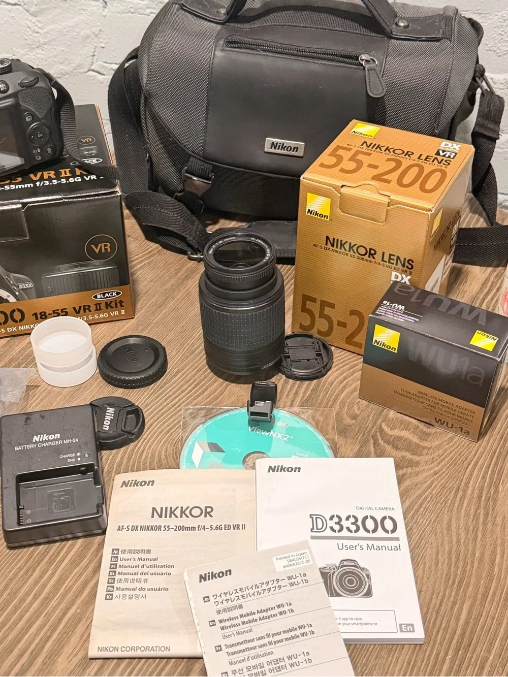 Nikon D3300 DSLR Bundle — 18-55mm + 55-200mm VR, WU-1a, Bag, Boxes — 4,627 Shots